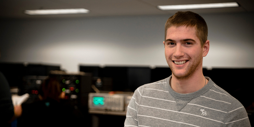 Centennial College School of Engineering Technology and Applied Science student in an Electrical Engineering Lab